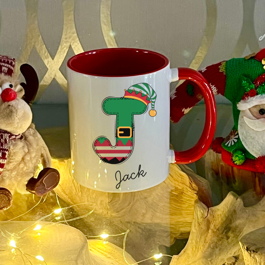 Personalised Red Elf letter christmas mug filled with Cadbury Chocolates