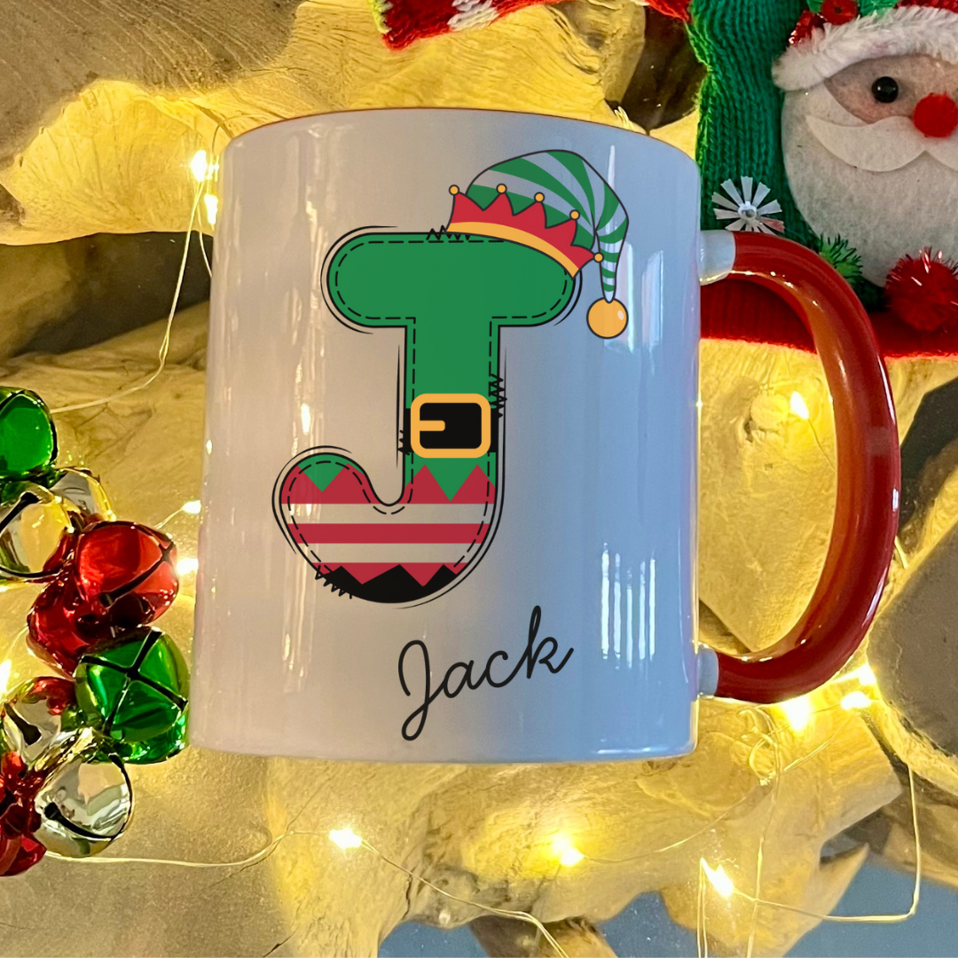 Personalised Red Elf letter christmas mug filled with Cadbury Chocolates