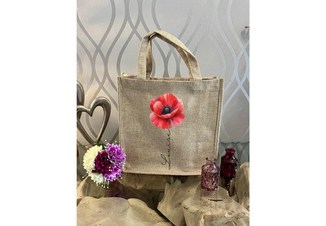 Personalised Red Poppy Mug & Gift Bag Set — custom name ceramic mug with vibrant red poppy design, red handle & interior, plus matching reusable eco-friendly linen gift bag. Perfect personalised gift for birthdays, thank yous, or special occasions. Handmade, thoughtful, and beautifully coordinated.