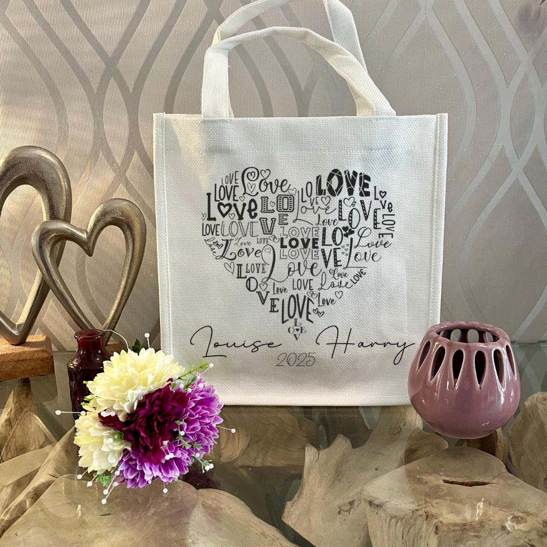 Personalised Couple Mug Set with Matching Gift Bag — two ceramic mugs form a complete heart design when placed together. Customise with names and special date. Optional eco-friendly linen gift bag in white or natural with matching heart motif. Perfect romantic gift for weddings, anniversaries, engagements or Valentine’s Day. Unique, thoughtful keepsake for couples.