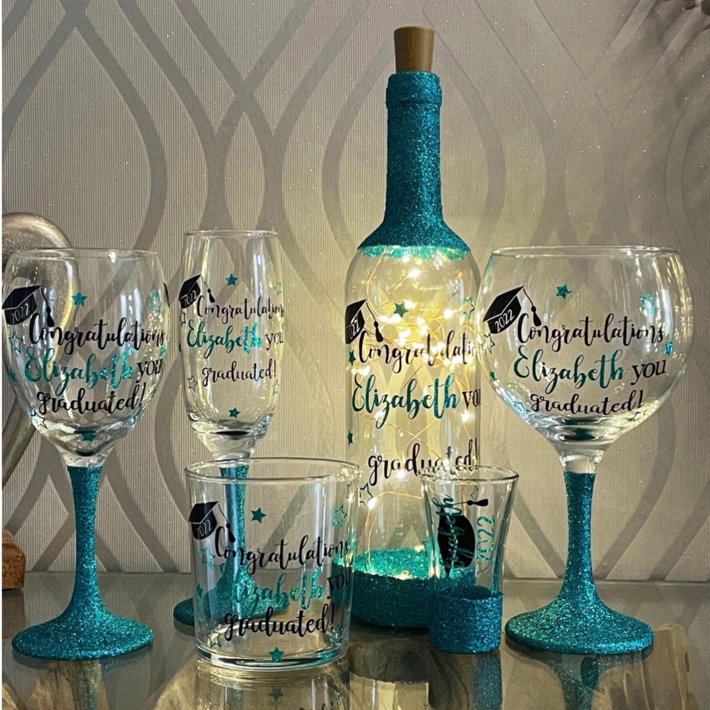 Graduation gift 2025 cePersonalised glitter graduation glass with custom name and year in sparkling vinyl. Ideal graduation gift or party keepsake. Choose from a variety of glitter colours. Perfect for celebrating and commemorating a special achievement in style. Graduation celebration glassware. Celebration gift for 2025