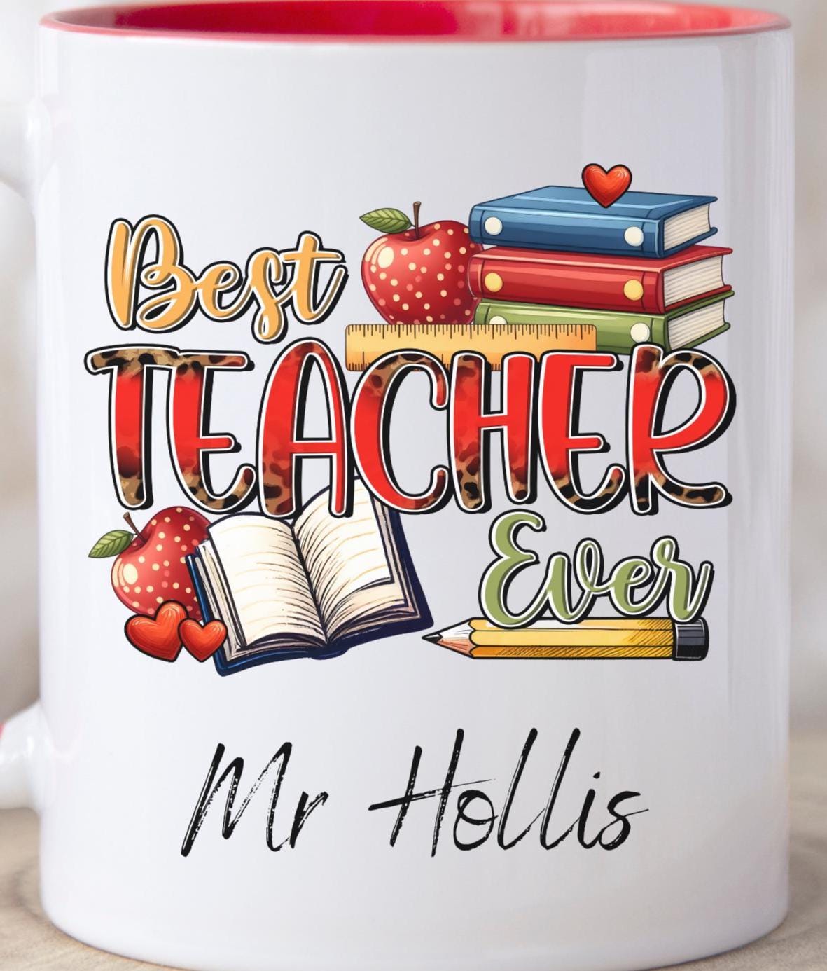 Fun and cheerful mug with the words “Best Teacher Ever” in bright, bold letters, surrounded by cute doodles of a books, shiny red apples, and a smiling yellow pencil. Teachers Gift. Under £10.