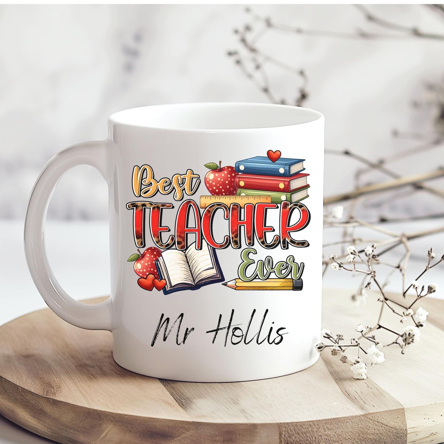 Fun and cheerful mug with the words “Best Teacher Ever” in bright, bold letters, surrounded by cute doodles of a books, shiny red apples, and a smiling yellow pencil. Teachers Gift. Under £10.