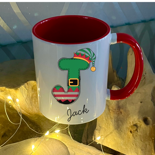 Personalised Red Elf letter christmas mug filled with Cadbury Chocolates