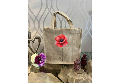 Personalised Red Poppy Mug & Gift Bag Set — custom name ceramic mug with vibrant red poppy design, red handle & interior, plus matching reusable eco-friendly linen gift bag. Perfect personalised gift for birthdays, thank yous, or special occasions. Handmade, thoughtful, and beautifully coordinated.