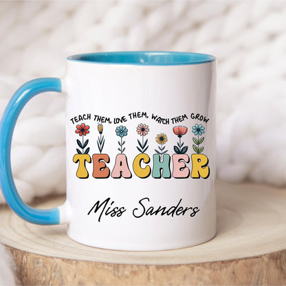 Custom teacher mug with name Miss Sanders, floral design, and quote &#39;Teach them, love them, watch them grow&#39; – personalized teacher gift for appreciation, end of school year, or back to school – colorful coffee mug for classroom or desk decor.